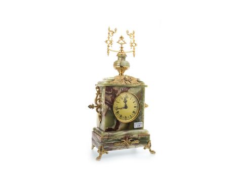 ONYX AND GILT METAL MANTEL CLOCK OF VICTORIAN DESIGN the round gilt dial with Roman numerals, contained in a rectangular case