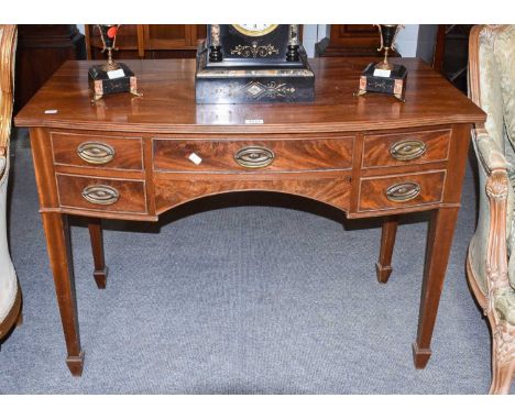 A reproduction mahogany bow fronted sideboard of small proportions, 106cm by 55cm by 78cm