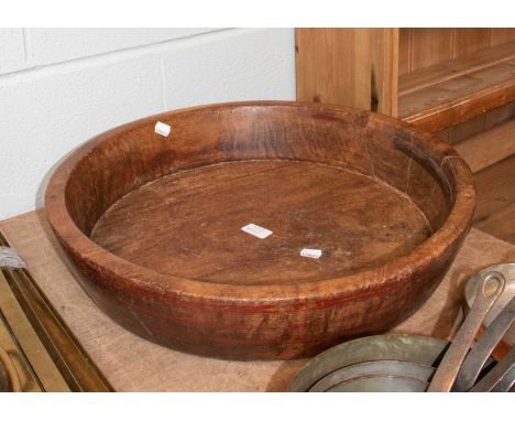A painted dugout bowl, possibly Scandanavian, with old iron bracket repair, 53cm diameter