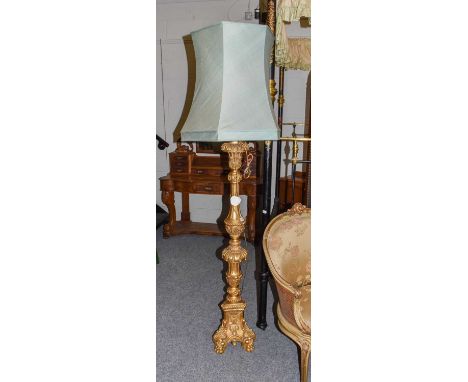 A Carved Giltwood Candlestand, late 19th/early 20th century, in the form of a lamp, the acanthus and fluted carved bulbous su