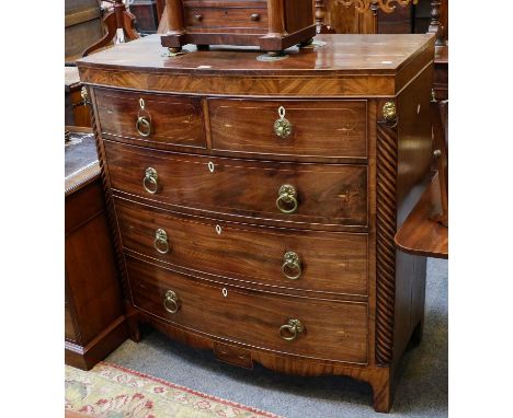 A George III inlaid mahogany bow fronted four height chest of drawers, the two short over three long graduated cock-beaded dr