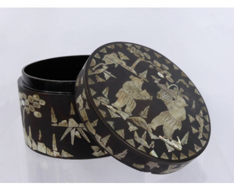 A Vintage Chinese Cylindrical Box, with decorative mother of pearl inlay, depicting figures in a garden.
