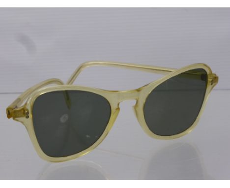 A Pair of Vintage Sun Glasses in a Theodore Hamlin, Wimpole Street, London.