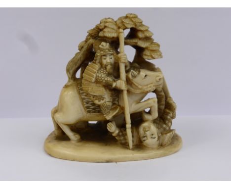 An Antique Japanese Ivory Carved Netsuke, depicting a mounted Samurai warrior slaying another, with character marks to base, 