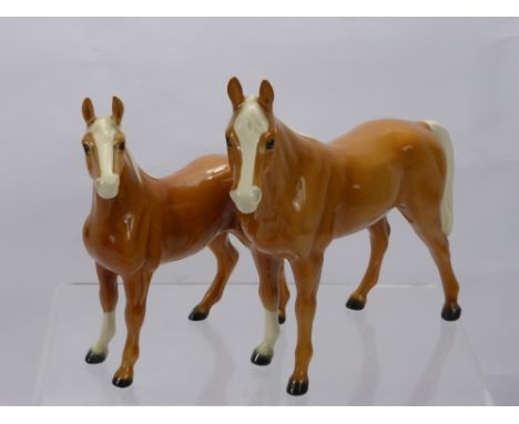 Goebel Porcelain Figures of a Palomino Stallion together with a mare and two Beswick figures of horses. (af)