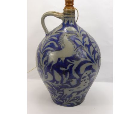 A Generously Proportioned Stoneware Westerwald,Blue Glazed Flask, converted into a lamp base, the flask depicting a foliate d