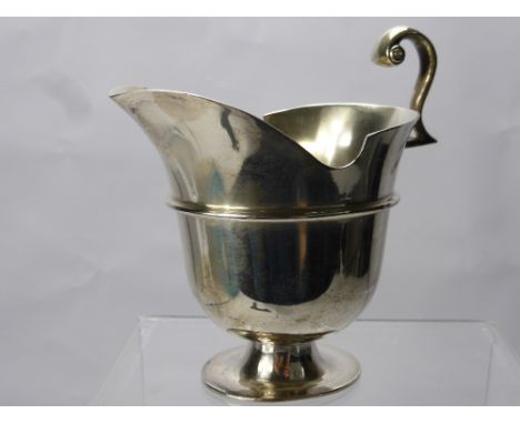 A Victorian Silver Helmet Creamer, London hallmark dd 1871, mm Henry John Lias & Henry John Lias, together with a toast rack,