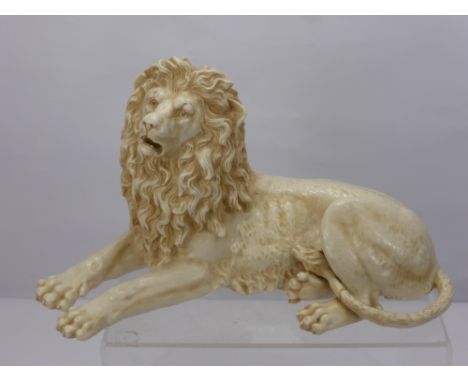 A Continental Ceramic Lion, depicted reclining, with factory marks to base FW within a diamond, nr 3710, approx 50 cms