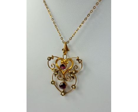 A Lady's 9 Ct Gold, Gilded Ruby and Seed Pearl Pendant, total wt 2.9 gms. 4.6 mm ruby, 3.6 mm ruby, 11 seed pearls.