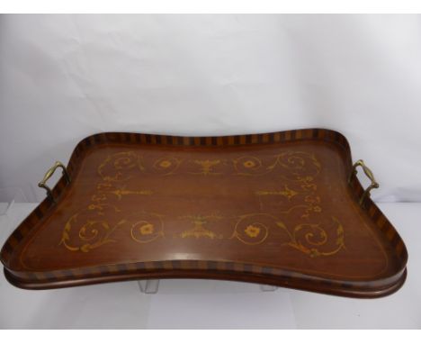 An Edwardian Inlaid Tea Tray, the scallop form tray having a floral and basket design with brass handles together with a vint