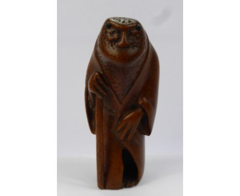 A Meiji Period Japanese Box Wood Netsuke, depicting a salamander wearing robes, beautifully carved with rich patina, approx 5