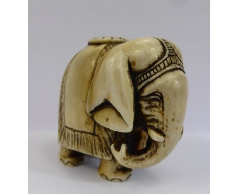 A Meiji Period Japanese Ivory Netsuke, depicting an Asian elephant, approx 4 x 4 cms, character marks to hind leg.
 Provenanc