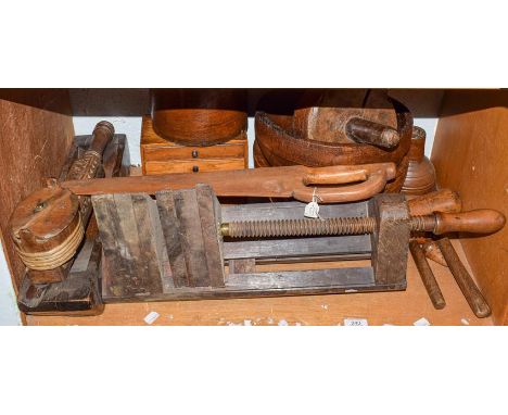 A quantity of 19th century treen and wooden items including a grain measure, small specimen chest, carpenters clamp, folk art