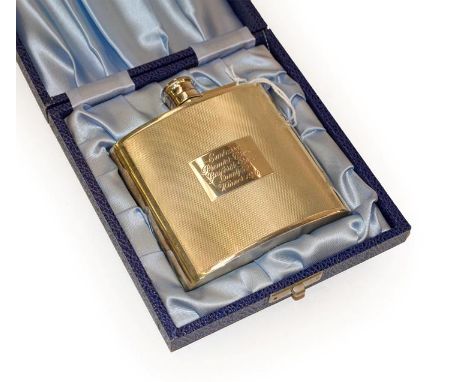 An Elizabeth II silver spirit flask, by K. L. Downes, Birmingham, 1976, slightly curved and with engine turned decoration, en