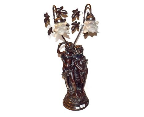 A bronzed composite figural twin branched table lamp, 65cm high 