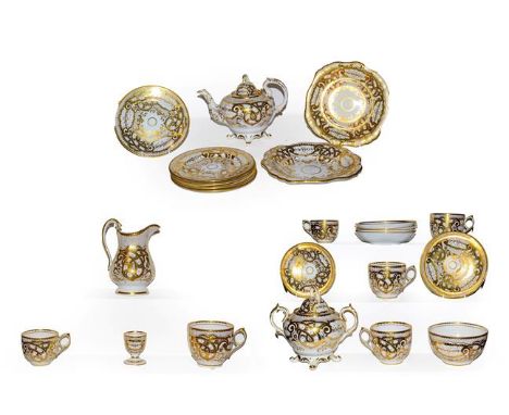 A 19th century English porcelain tea set with lavish gilt decoration, impressed M H &amp; Co (one tray)  Notes; Purportedly m