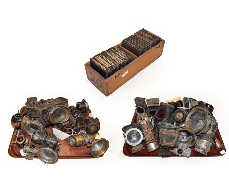 Two trays of cycling and motorcycling lamps, including a Millers Patent Bell Rock carbide lamp, together with a box of magic 