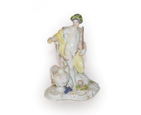 A Meissen Porcelain Figure of a Classical Youth Representing Autumn, circa 1750, standing wearing loose robes, an urn at his 