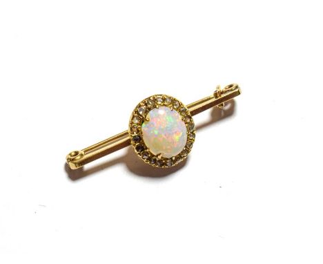 A 9 carat gold opal and diamond cluster bar brooch, length 3.8cm .  Gross weight 3.5 grams. 