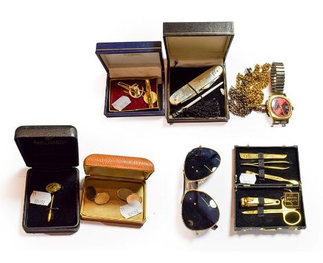 A silver penknife, two chains with gold T-bars, a pair of plated cufflinks and other gentleman's items 