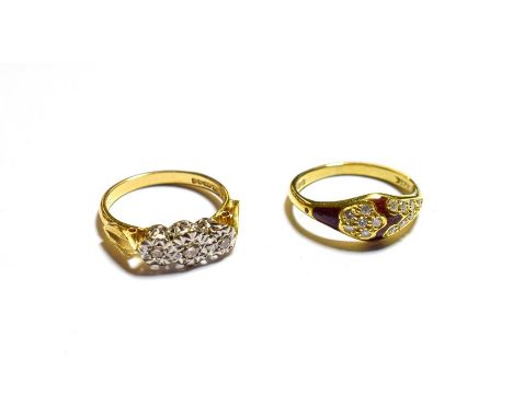 An 18 carat gold diamond three stone ring, finger size L1/2 and an 18 carat gold red enamel and diamond ring, finger size L. 