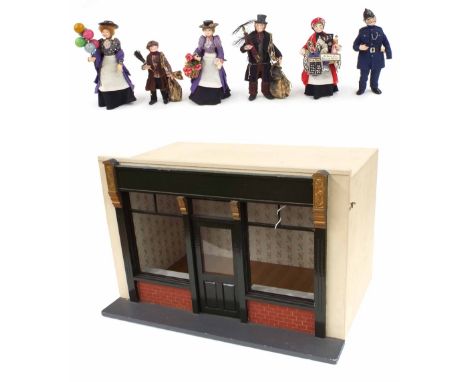 Cold painted lead scale model figures with a scale house shop, including chimney sweep, balloon vendor, street vendor, police