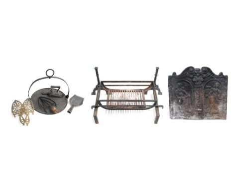 Cast iron figural fire back in the antique style, 24" wide, height 22.5"; together with a wrought iron fire grate with hand i