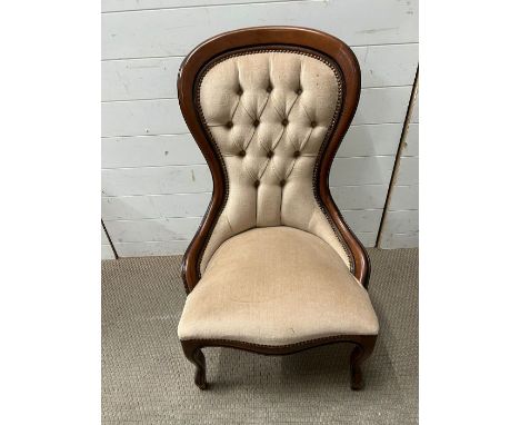 A Victorian style nursing chair with button back 