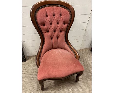 A Victorian style nursing chair with pink button back upholstery 