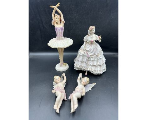 A selection of porcelain figures to include Royal Worcester 