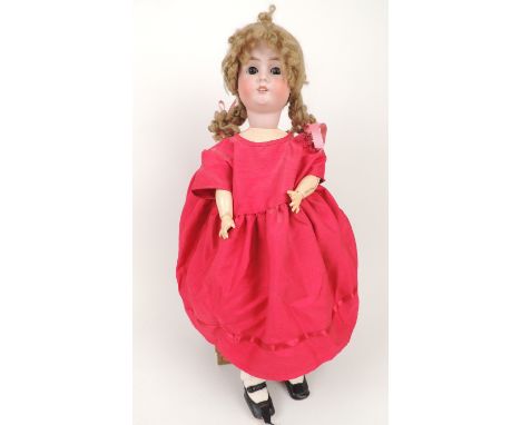 Schoenau and Hoffmeister bisque headed girl doll, mould mark '1906/9', rolling eyes with painted lashes, jointed composition 