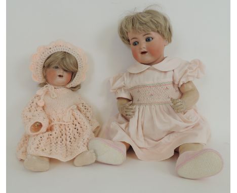 Armand Marseille bisque headed boy doll, mould mark '990/13', rolling glass eyes with painted lashes, wide open mouth with tw