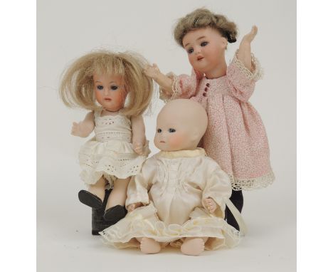 Herman Steiner miniature bisque doll, fixed blue glass eyes, probably modern bisque body, 15cm; also an Armand Marseille mini