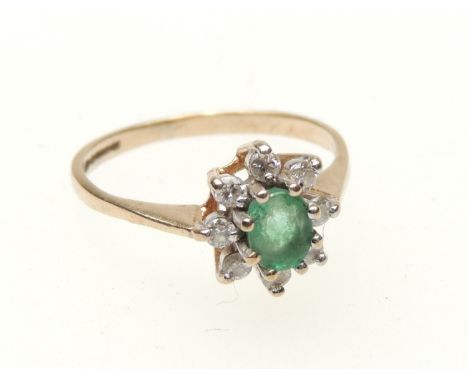 Emerald and diamond cluster ring, oval cut emerald of approx. 0.25ct, bordered with eight small round cut diamonds set in 9ct