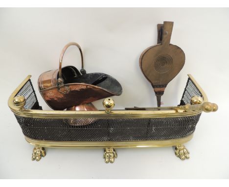 Victorian brass mounted wirework fender with paw feet, width 82.5cm, depth 26cm; also a Victorian copper coal scuttle (worn),