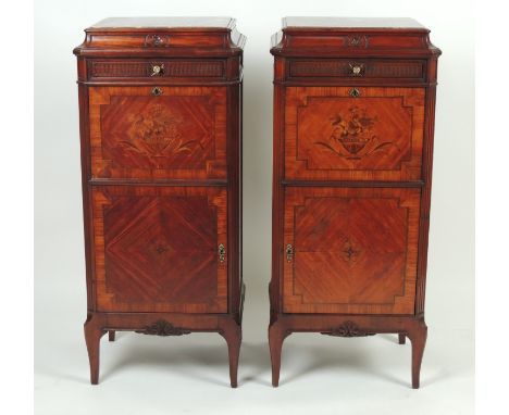 Pair of French kingwood and walnut cabinets, in Louis XVI style, having a marble top over a flute fronted frieze drawer and a