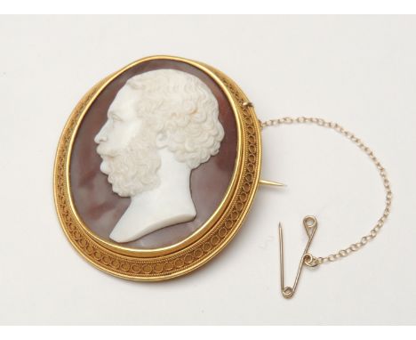 Victorian gold mounted portrait cameo brooch, circa 1880, finely carved with a profile of a bearded gentleman, mounted within