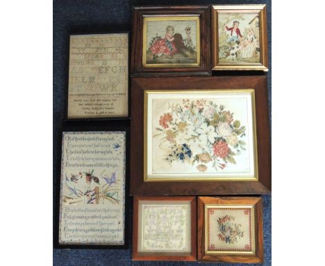 Three Victorian framed needlework tapestries, the largest being a floral bouquet within a rosewood frame, 57.5cm x 49.5cm ove