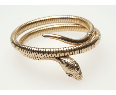 9ct gold serpent bangle, hallmarked Chester 1961 (one ruby eye deficient), gross weight approx. 30.2g (Please note condition 