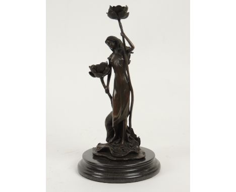 French Art Nouveau style bronze figural candlestick, cast as a water nymph holding lotus flowers, on a composite marble, heig