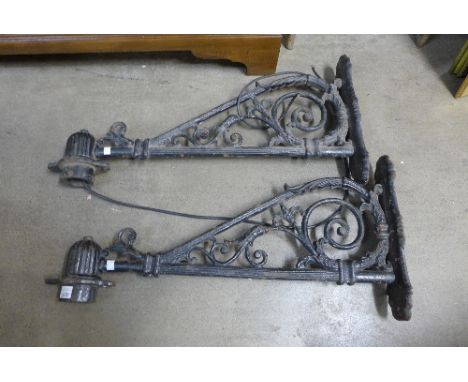 A pair of cast iron lantern brackets