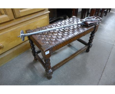An oak and brown leather stool and shooting stick