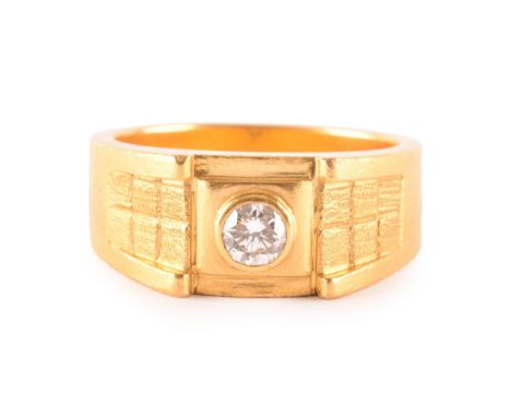 A high carat gold gents dress ring, bezel-set with a round brilliant-cut diamond of approximately 0.33 carats, approximate co