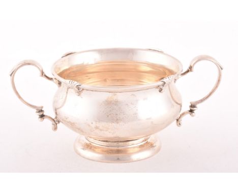 A George V silver two handled sugar basin, hallmarked Birmingham 1926 by Adie Brothers Ltd, numbered to base, 14.5 x 9 x 6cm,