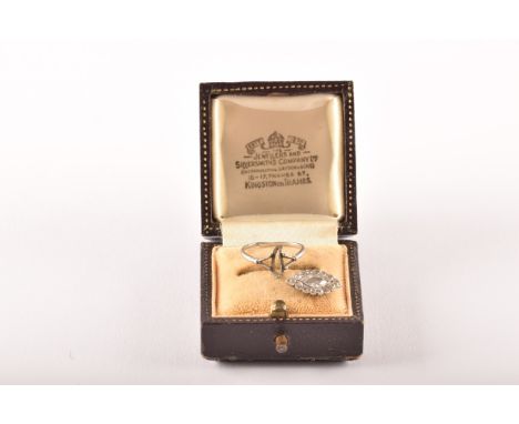An early 20th century white metal cluster ring (unmarked, tested as platinum), to include the detached head of the ring set t