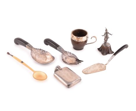A group of silver items, to include a hip flask, Malaysian silver and horn handled serving spoon, fork and cake slice, along 