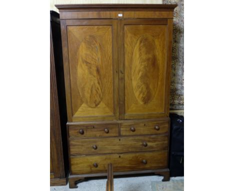 Georgian Mahogany Gents Wardrobe, the 2 flame mahogany upper doors over a base with 2 short drawers and 2 long drawers, brack
