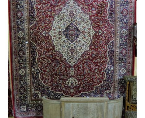 Large red ground Kashmir Carpet, traditional medallion design, 2.35 m by 3.5m