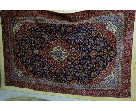 Large blue ground full pile Persian Kashan Carpet, with a traditional medallion design with a unique blue ground centre, red 