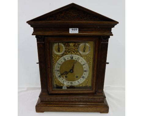 Edwardian Oak Cased Bracket Clock, with doric columns and an engraved brass and silvered dial and Westminster Chime, 15”w x 1